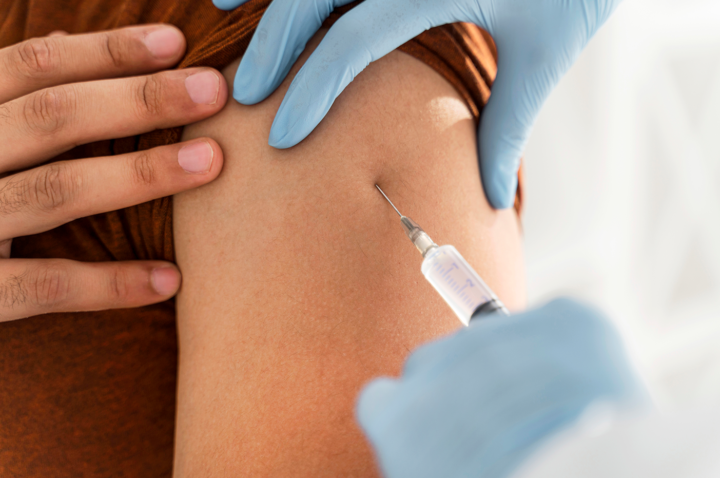 close-up-man-being-vaccinating-by-doctor